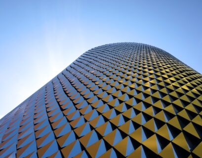 a very tall building with a sky background