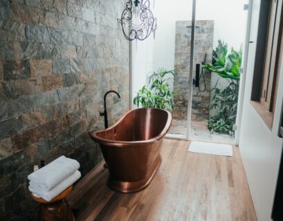 green bathroom brown plastic bucket near white framed glass door