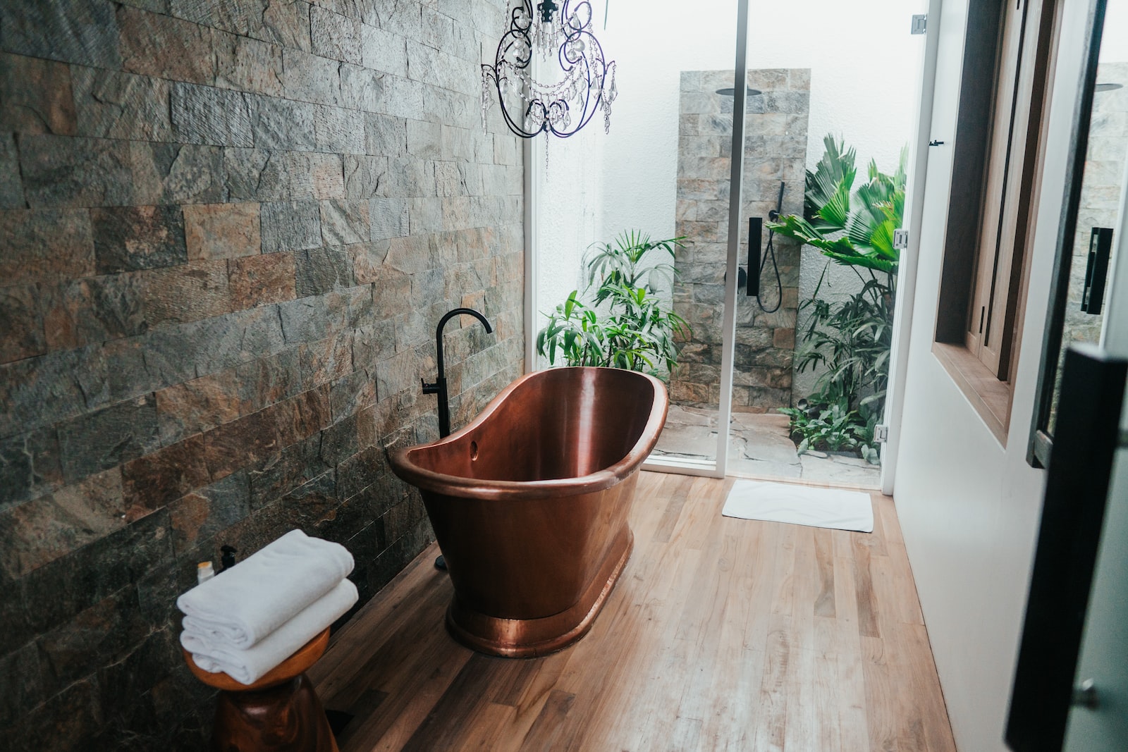 green bathroom brown plastic bucket near white framed glass door