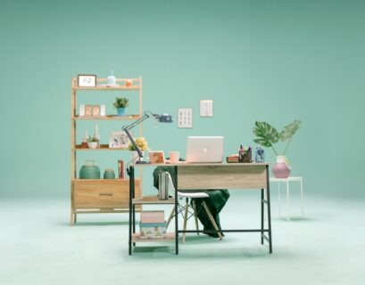 silver macbook on brown wooden table