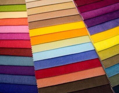 multi colored striped textile on brown wooden table