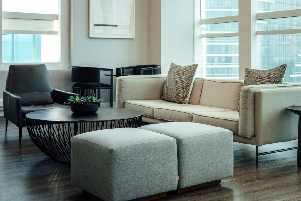 gray 2 seat sofa near round table