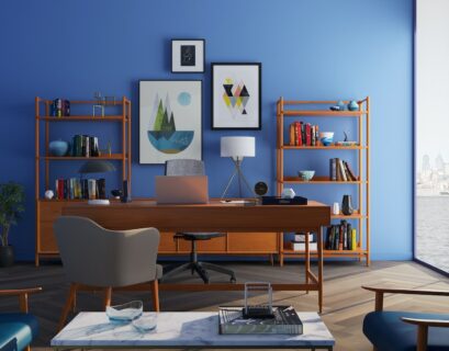 Brown Wooden Desk With Rolling Chair and Shelves Near Window