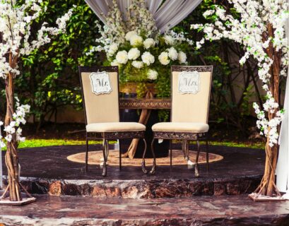 two black steel chairs beside table
