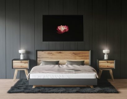 a bedroom with a bed, nightstands and a painting on the wall